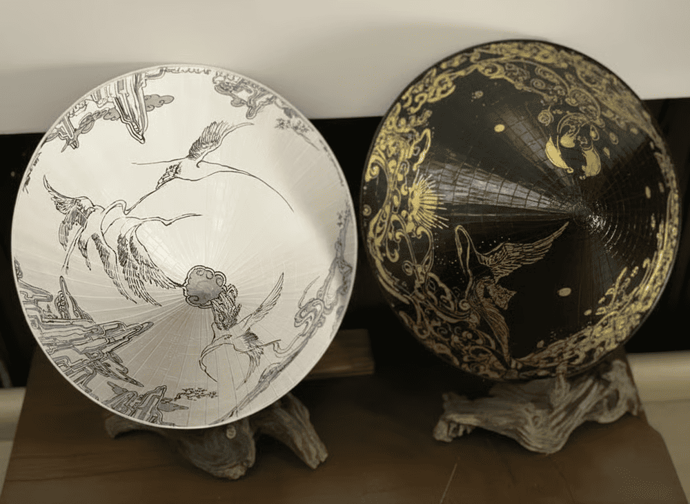 The conical hat is also stylized with intricate hand-embroidered details, adding a unique touch to this traditional Vietnamese item